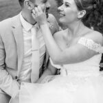 bride and groom cudles