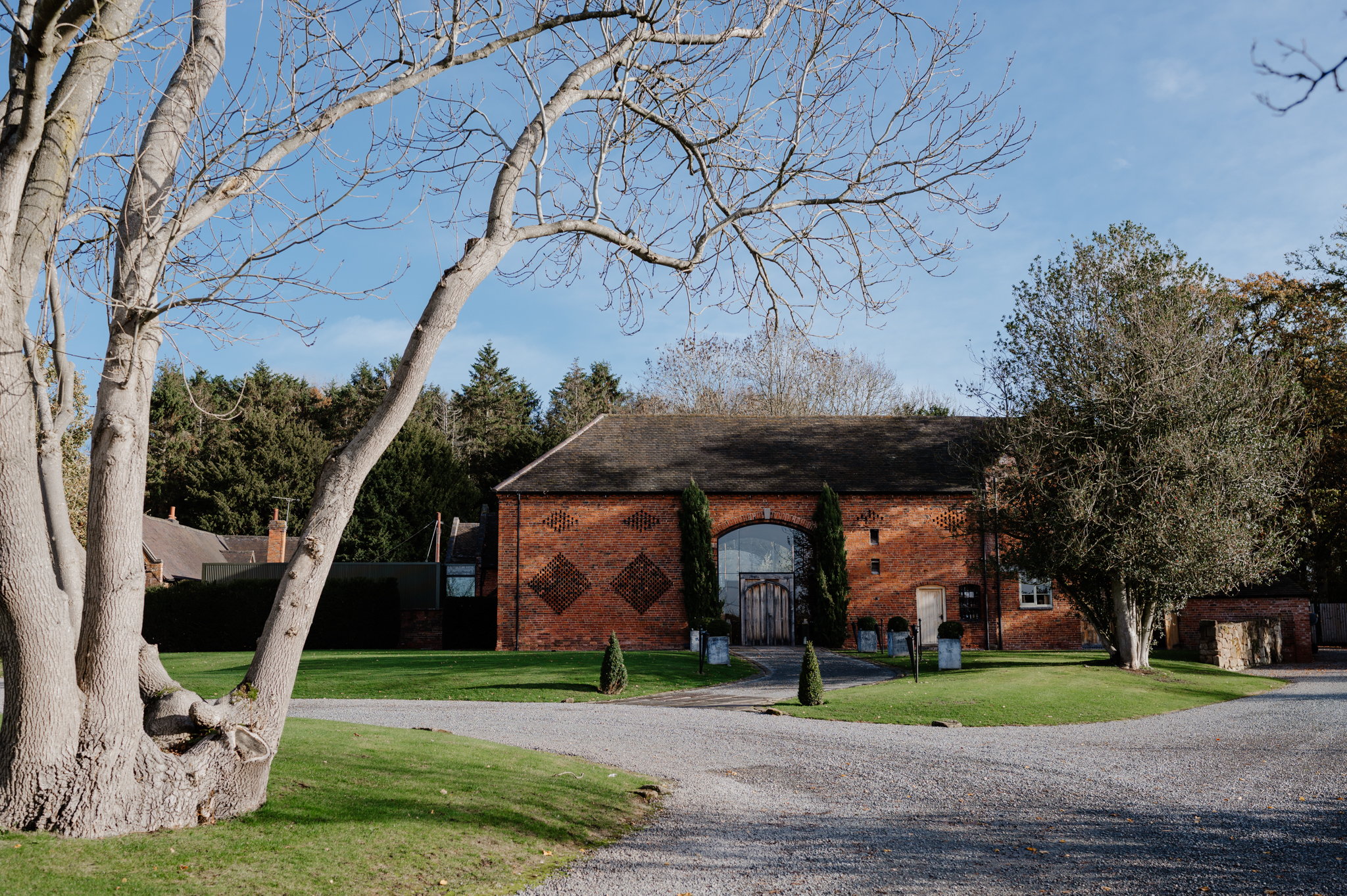 Shustoke Barn wedding venue exterior in autumn, decorated for a wedding.